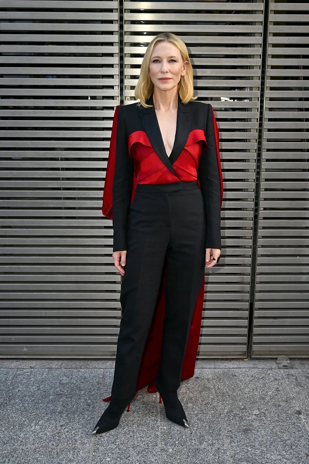 Cate Blanchett Stuns in Striking Red Cape and Edgy Knit Heels for McQueen